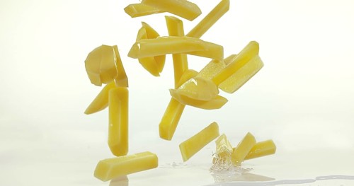 French Fries, Charlotte Potato (solanum tuberosum), Vegetable falling on Water against White