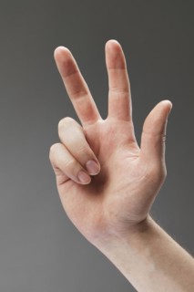 Hand of a man with three fingers pointing