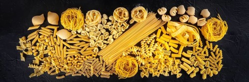 Italian pasta panorama, a flat lay texture of many different pasta kinds, shot from the top on a