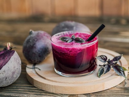 Wooden tray with glass beetroot juice. High resolution photo