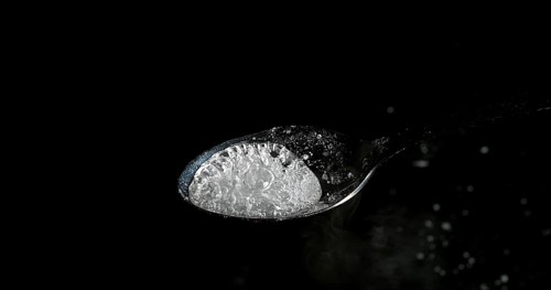 Drug, Cocaine in spoon against black background