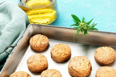 Cannabis butter cookies with marijuana buds and cannaoil, homemade healthy biscuits in a baking