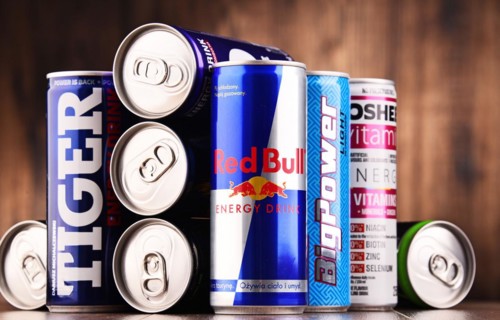 POZNAN, POLAND - JULY 27, 2017: Cans of popular global energy drinks, beverages containing