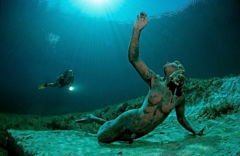 Diver in a mountain lake and King Ludwig mermaid, Germany, Bavaria, Europe