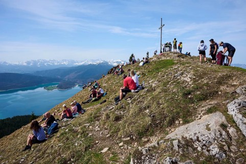 Many hikers take a break at the summit of the Jochberg, Walchensee, Upper Bavaria, Bavaria,