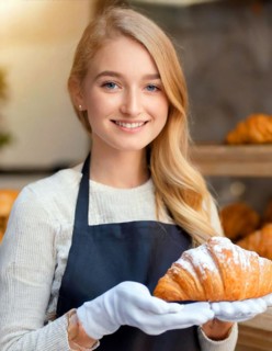 KI generated, woman, 20, 25, years, shows, bakery, bakery shop, baquette, white bread, croissant,