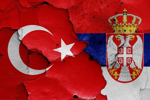 Flags of Turkey and Serbia painted on cracked wall