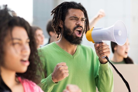 People protesting streets with megaphones
