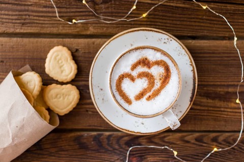 Top view coffee cup heart shaped cookies