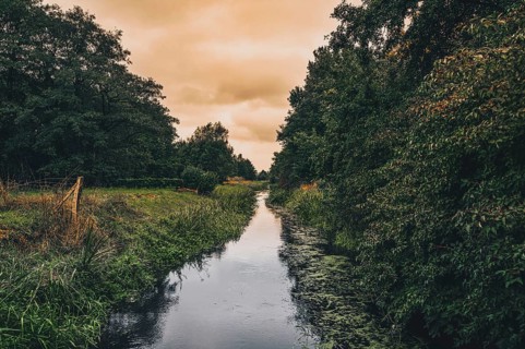 The river Wietze in Isernhagen near Hanover in autumn during rainy weather and sunset, Isernhagen,