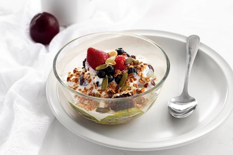High angle yogurt with cereals fruits
