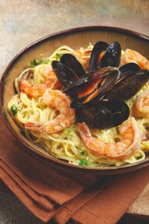 Spaghetti carbonara, with shrimp and mussels, seafood in creamy garlic sauce, homemade, no people