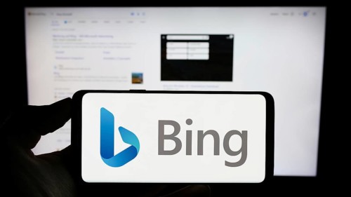 Stuttgart, Germany, 09-22-2023: Person holding cellphone with logo of web search engine Microsoft