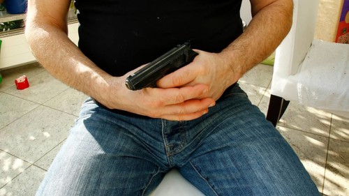 Hands holding a pistol