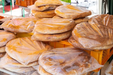 Packaged flatbreads for sale at a market stall