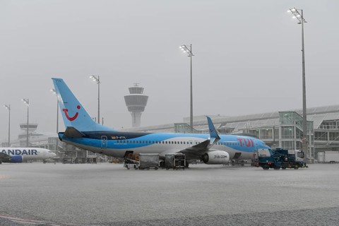 Tui fly Boeing B737-800 on handling position during heavy rain, thunderstorm, rain cloud, storm,