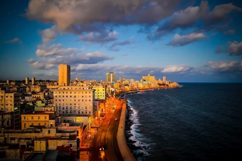High angle view on Havana malecon coastal road and cityscape during sunset. Travel and tourism