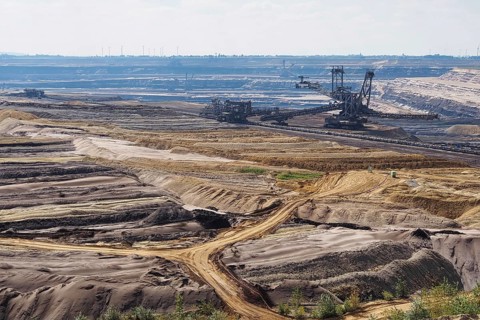 View over the Garzweiler open-cast lignite mine with large excavator, Rhenish lignite mining area,