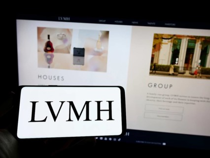 Stuttgart, Germany, 04-16-2023: Person holding mobile phone with logo of company LVMH Moet Hennessy