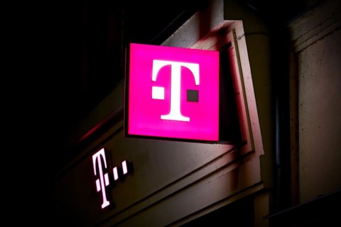 Illuminated sign at a Telekom shop in the city centre of Karlovy Vary in the Czech Republic at