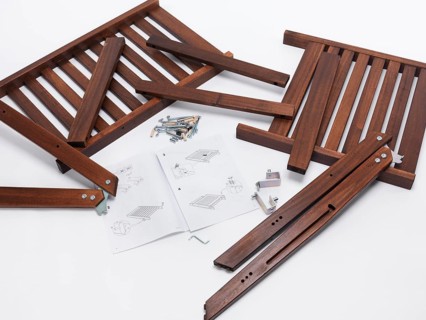 Assembling IKEA furniture parts with instructions