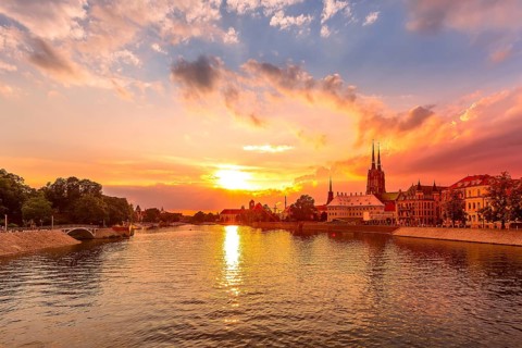 Wroclaw, Poland colorful sunset panorama with Ostrow Tumski island, Odra or Oder river and