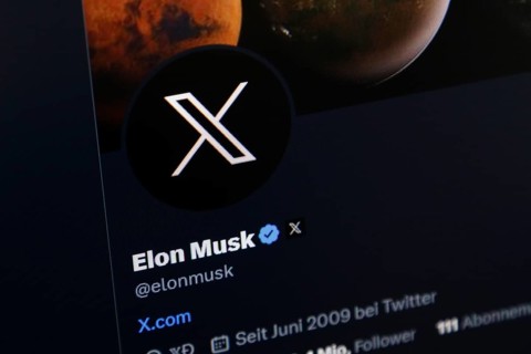 Symbolic image social media, close-up of a dark screen with X logo in Elon Musk's account on the