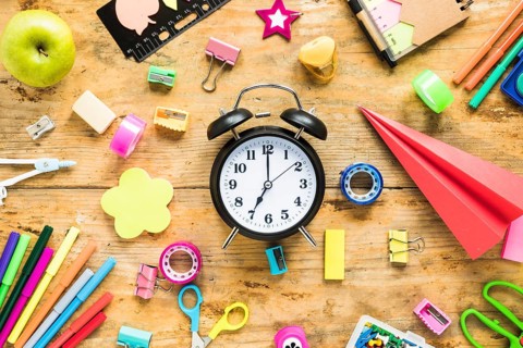 School office supplies wooden background