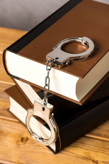 Close up with handcuffs books
