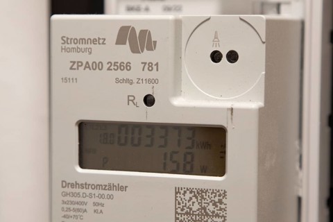 Symbolic image of energy costs in the household, digital electricity meter in a flat, operator