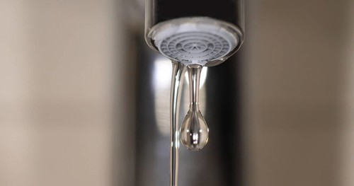 Water Flowing from the Tap, making a drop of water