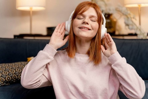 Portrait woman home listening music 6