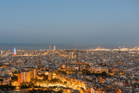 Top view and night photography from an illuminated Barcelona. The panorama shows the famous Sagrada