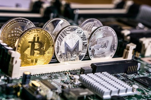 Golden Bitcoin and altcoins Monero and dash Cryptocurrency on computer circuit board. Blockchain