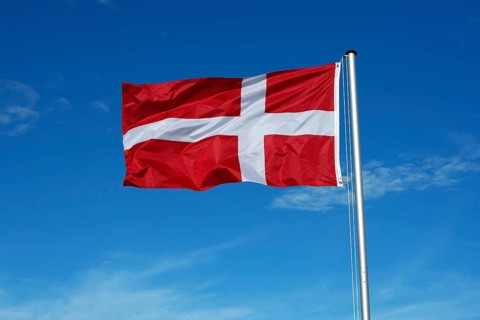 The flag of Denmark flutters in the wind