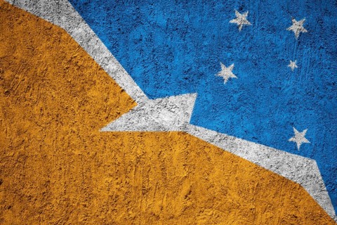 Bandera de la Provincia de Tierra del Fuego flag painted on the cracked grunge concrete wall
