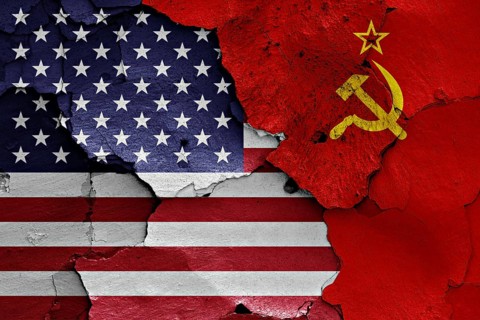 Flags of USA and Soviet Union painted on cracked wall