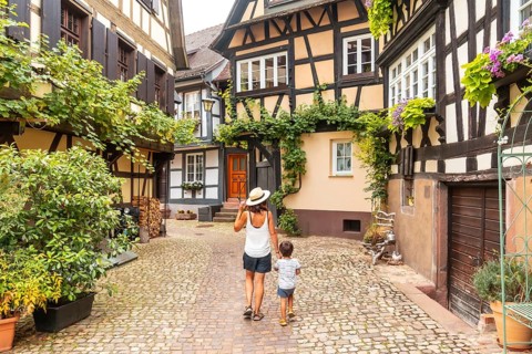 Mother and son in the medieval village in the old town of Gengenbach in the Black Forest, Germany,