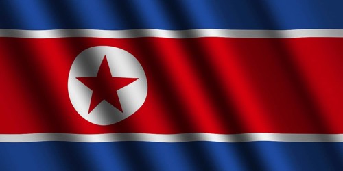 The North Korea flag flying in the wind