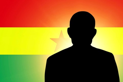 The Ghana flag and the silhouette of an unknown man
