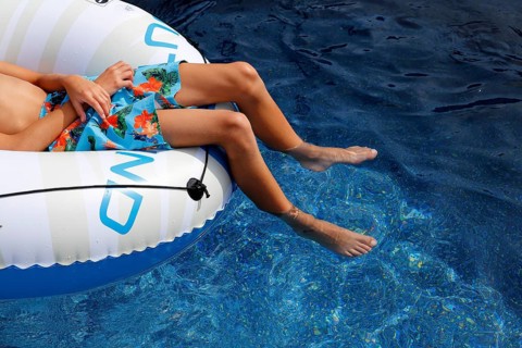 Summer, boy relaxing in swimming pool, Province of Quebec, Canada, North America
