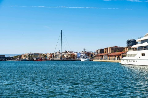 A very large luxury yacht is anchored in the harbour of Tarragona, Spain, Europe