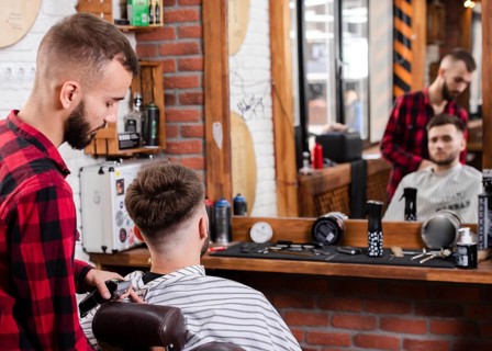 Barber showing haircut customer