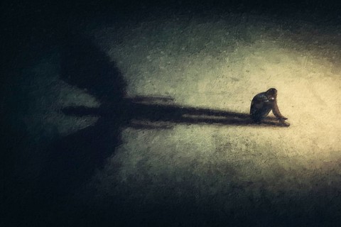 Surreal painting of a man sitting alone isolated in a dark room, casting a shadow of a powerful