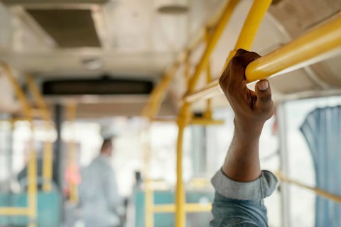 Close up hand holding bus bar