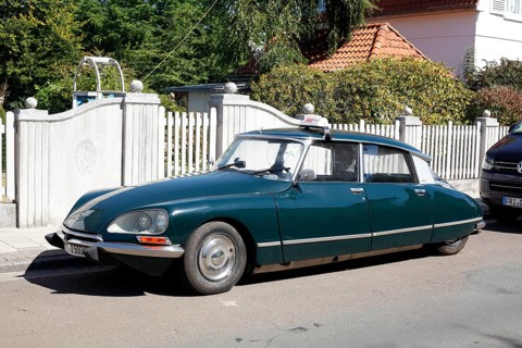 Vintage Citroen DS parked on the street in front of a garden fence, Varel, Lower Saxony, Germany,