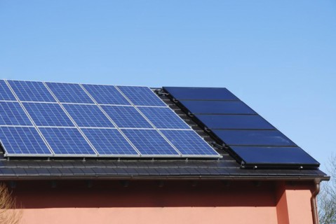 House roof with photovoltaics installation and solar heating system