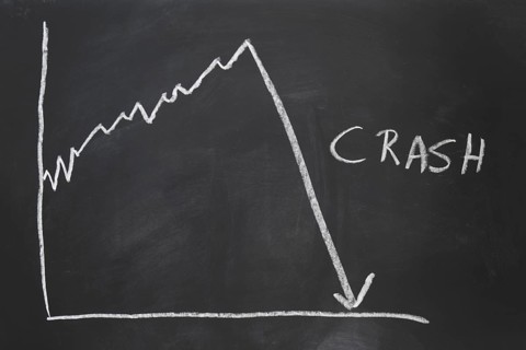 stock market crash - economy crisis - hand-drawn graph on chalkboard