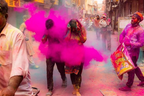 Holi Festival of Colors in the streets of Mathura, India, Asia