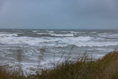 Stormy sea, foaming sea in storm with high waves on the English Channel, Portbail, Cotentin,